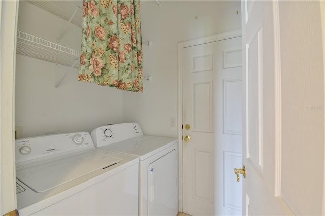 washroom with independent washer and dryer