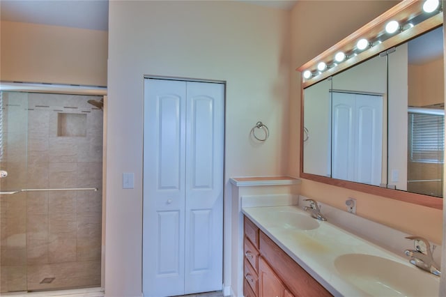 bathroom featuring vanity and an enclosed shower