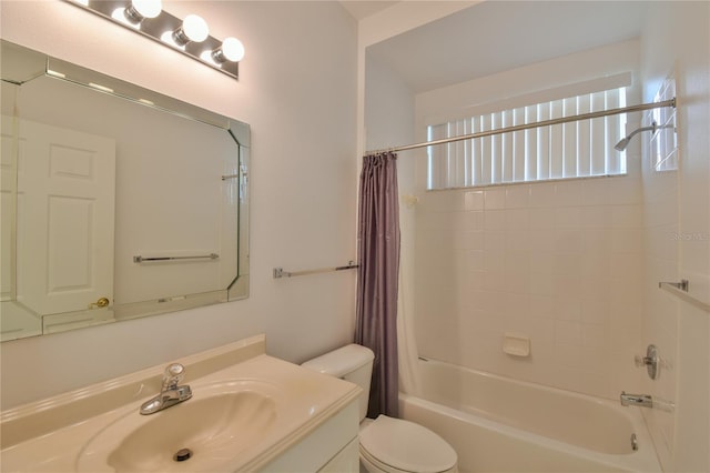 full bathroom featuring shower / tub combo with curtain, vanity, and toilet