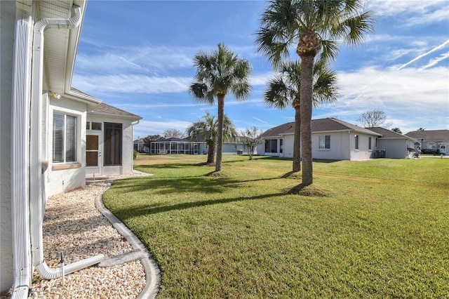 view of yard featuring a sunroom