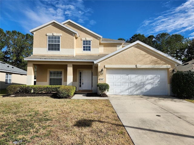 view of front of home with a porch, a garage, and a front lawn