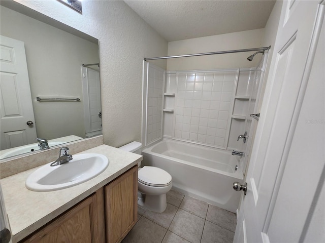 full bathroom featuring tile patterned floors, shower / bath combination, a textured ceiling, toilet, and vanity