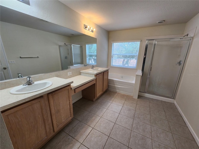 bathroom with tile patterned floors, plus walk in shower, and vanity