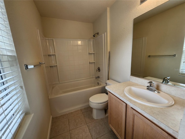 full bathroom with tile patterned flooring, vanity, tub / shower combination, and toilet