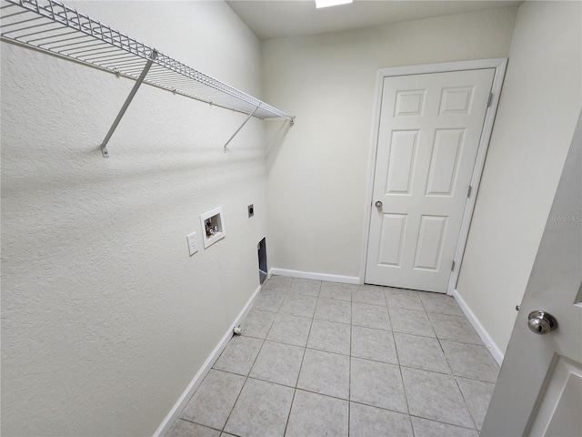 laundry room featuring light tile patterned floors, washer hookup, and hookup for an electric dryer