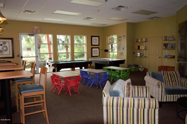 playroom with a paneled ceiling, carpet floors, and pool table