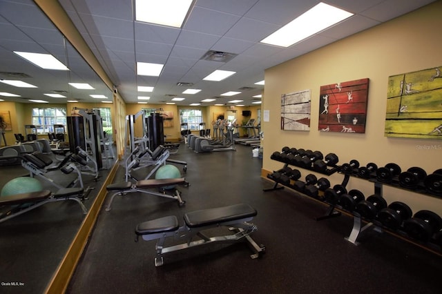 workout area with a drop ceiling