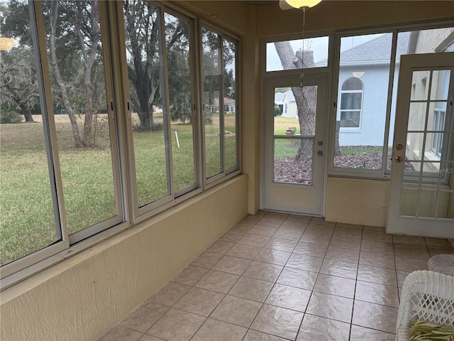 unfurnished sunroom featuring a wealth of natural light