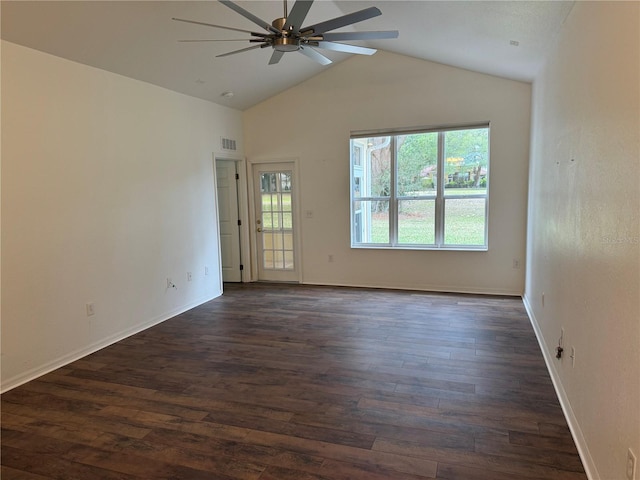 spare room with vaulted ceiling, ceiling fan, and dark wood-type flooring