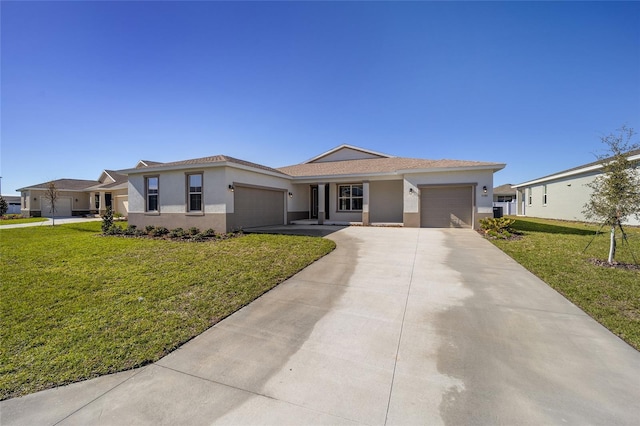 view of front of property with a front yard and a garage