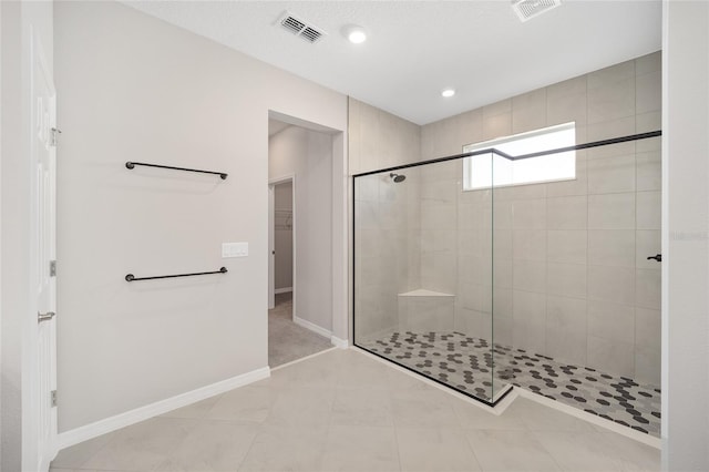 bathroom with a shower with shower door