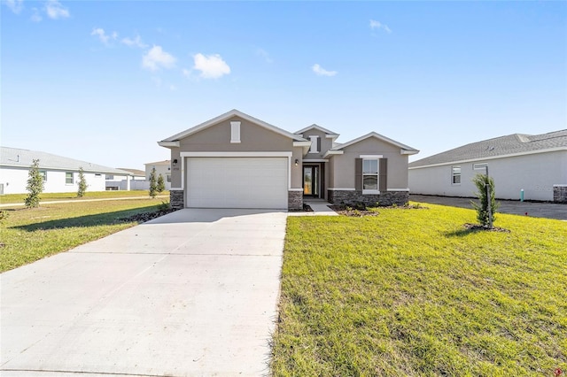 single story home featuring a garage and a front yard