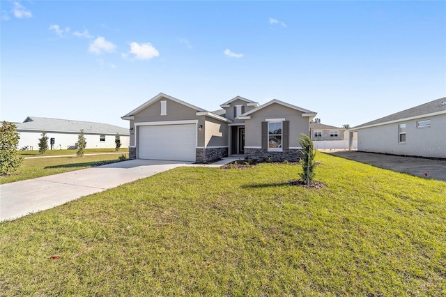 view of front of property with a garage and a front lawn