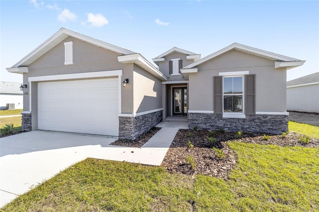 view of front of home featuring a front yard and a garage