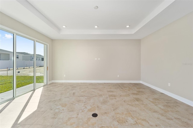 empty room with a tray ceiling