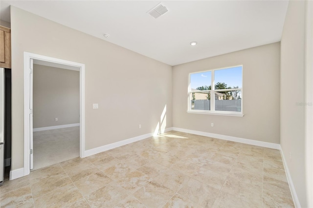 unfurnished room with light colored carpet