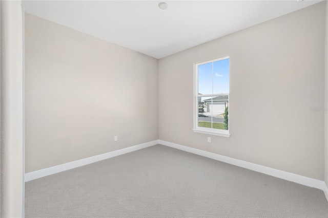 unfurnished room featuring carpet flooring