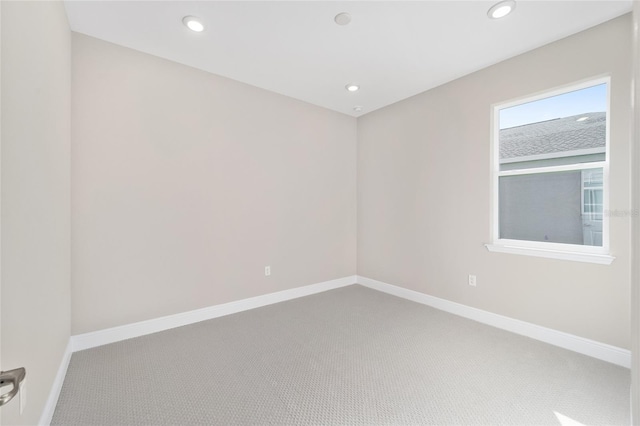 unfurnished room featuring carpet flooring