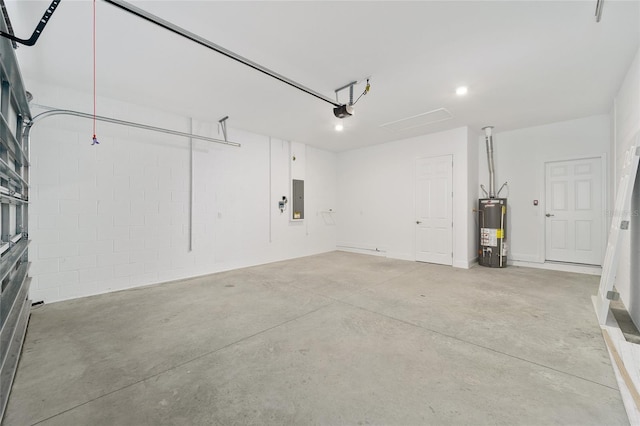 garage featuring electric panel, gas water heater, and a garage door opener