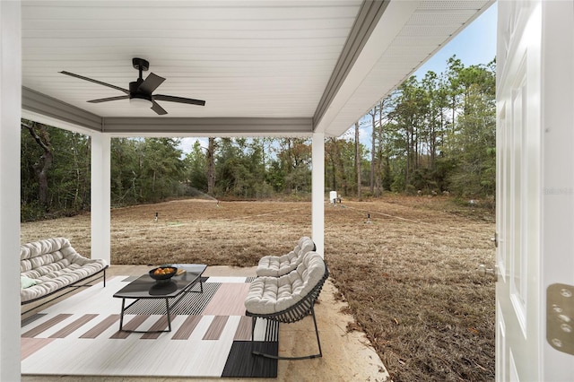 view of patio with an outdoor living space and ceiling fan