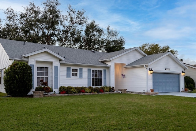 ranch-style house featuring a garage and a front yard