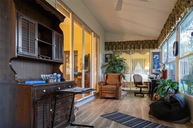 interior space with ceiling fan, light hardwood / wood-style floors, and lofted ceiling