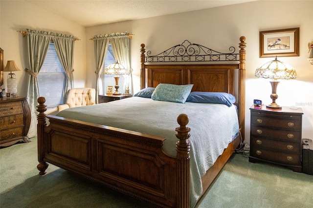 carpeted bedroom with vaulted ceiling