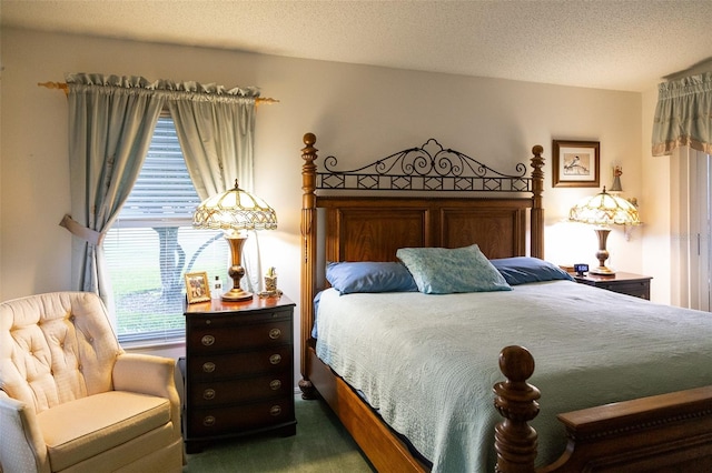 carpeted bedroom featuring a textured ceiling