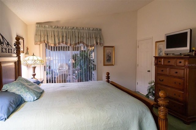 bedroom with access to exterior and lofted ceiling