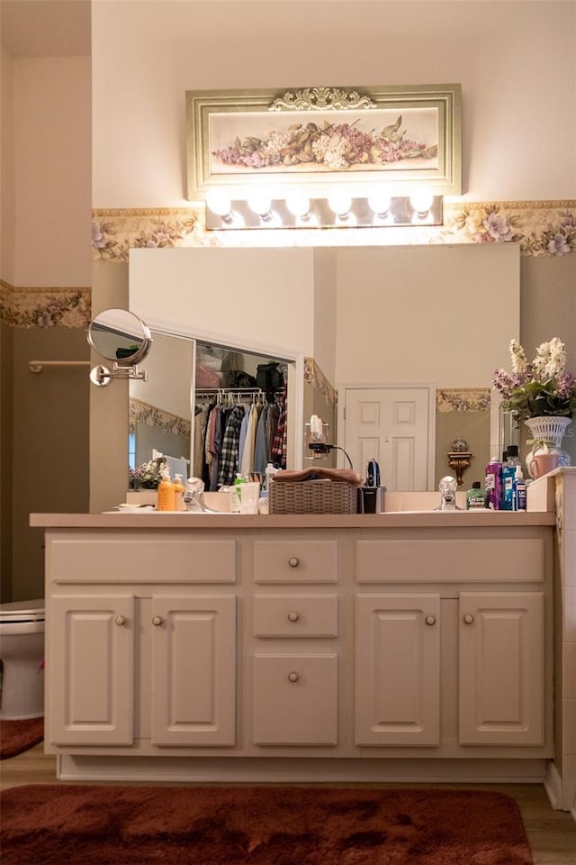 bathroom with vanity and toilet