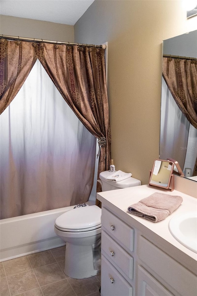 full bathroom featuring shower / bathtub combination with curtain, tile patterned flooring, vanity, and toilet