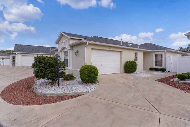 ranch-style home featuring a garage