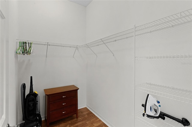 walk in closet featuring dark hardwood / wood-style flooring