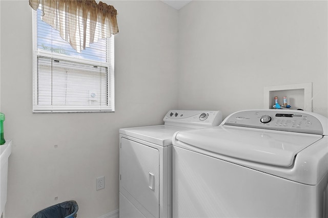 laundry area featuring washing machine and clothes dryer