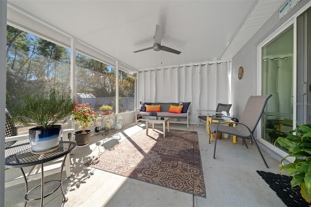 sunroom featuring ceiling fan