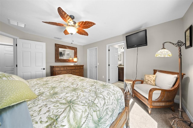 carpeted bedroom featuring ensuite bathroom and ceiling fan