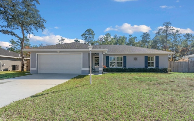 single story home featuring a garage and a front yard