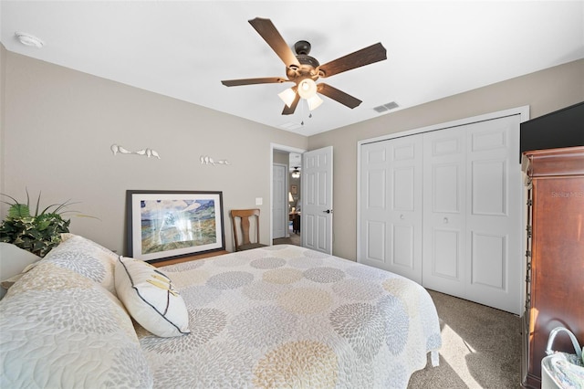 bedroom with ceiling fan, carpet flooring, and a closet