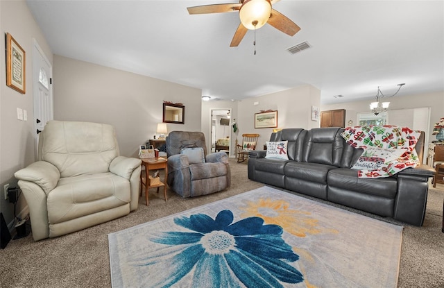 living room featuring ceiling fan with notable chandelier and light carpet