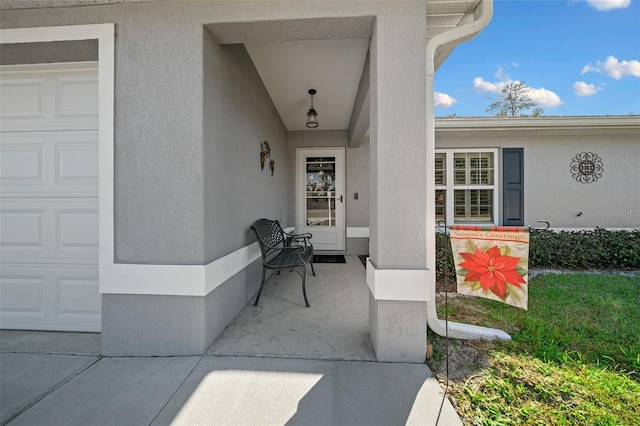 doorway to property featuring a garage