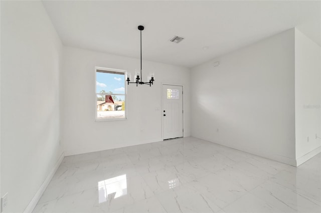 interior space with a chandelier