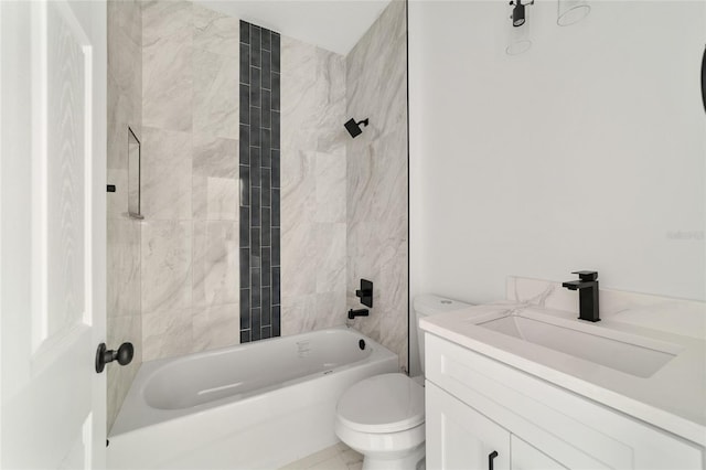 full bathroom featuring vanity, toilet, and tiled shower / bath