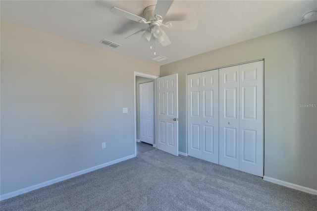 unfurnished bedroom featuring carpet flooring, ceiling fan, and a closet