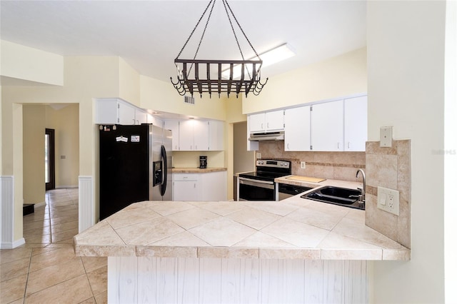 kitchen with white cabinetry, sink, stainless steel appliances, tile countertops, and pendant lighting