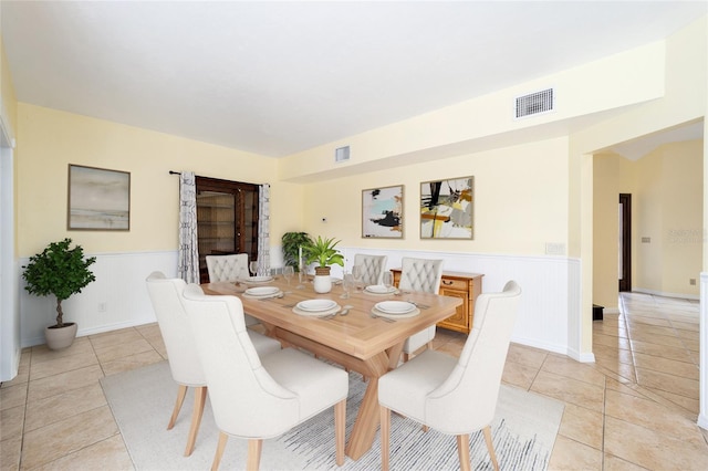 dining space with light tile patterned floors