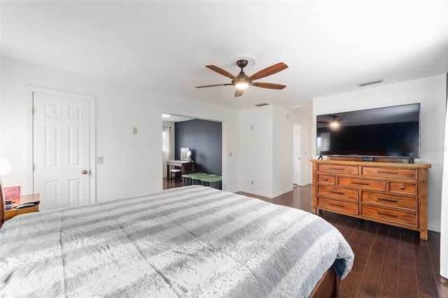 bedroom featuring dark hardwood / wood-style floors and ceiling fan