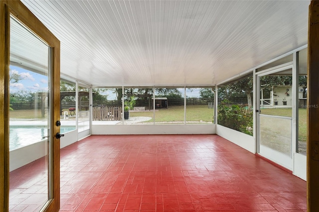 unfurnished sunroom featuring a healthy amount of sunlight