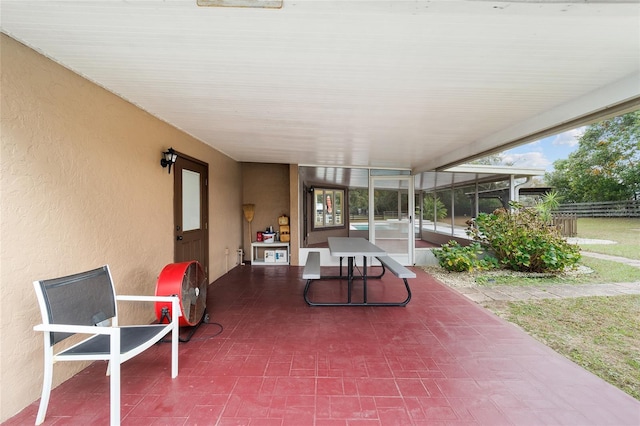 view of patio / terrace featuring a sunroom