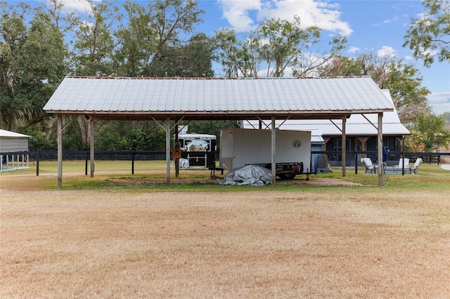 view of vehicle parking featuring a carport