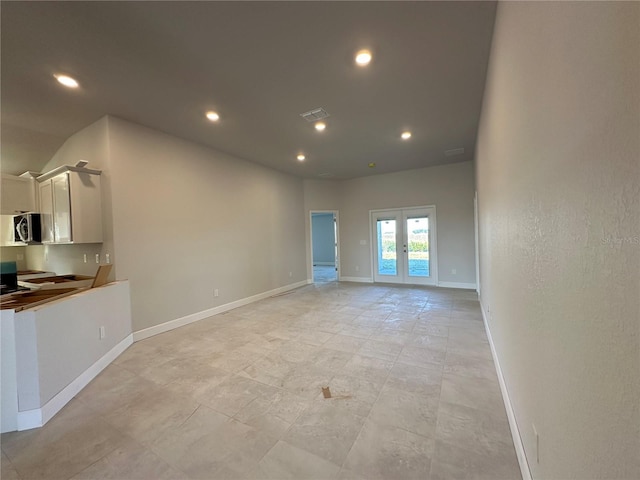 unfurnished living room with french doors